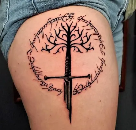 Tree of Gondor and Narsil sword tattoo on a woman's leg