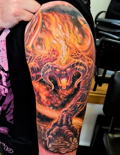 Detailed Balrog and flames full arm tattoo for men