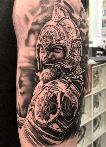 Detailed Théoden arm tattoo 