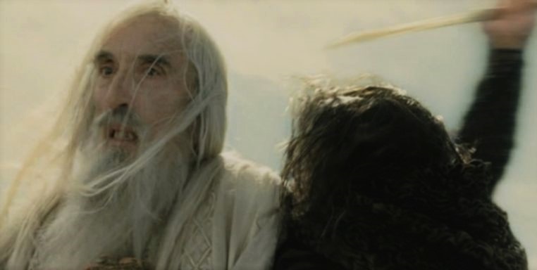 Saruman being stabbed by Grima Wormtongue
