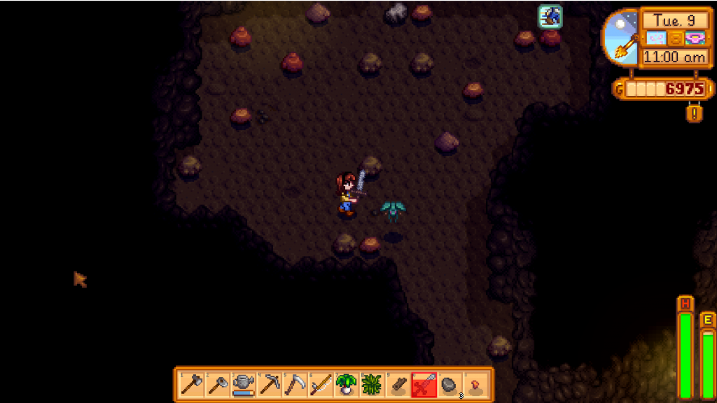 Attacking a bug monster with a sword, while exploring the Mines in Stardew Valley