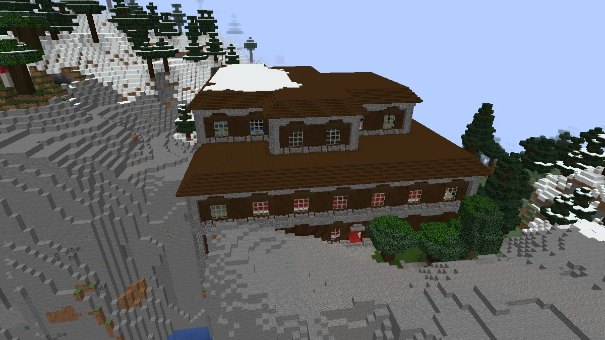 Snowcapped Woodland Mansion with mountains around it